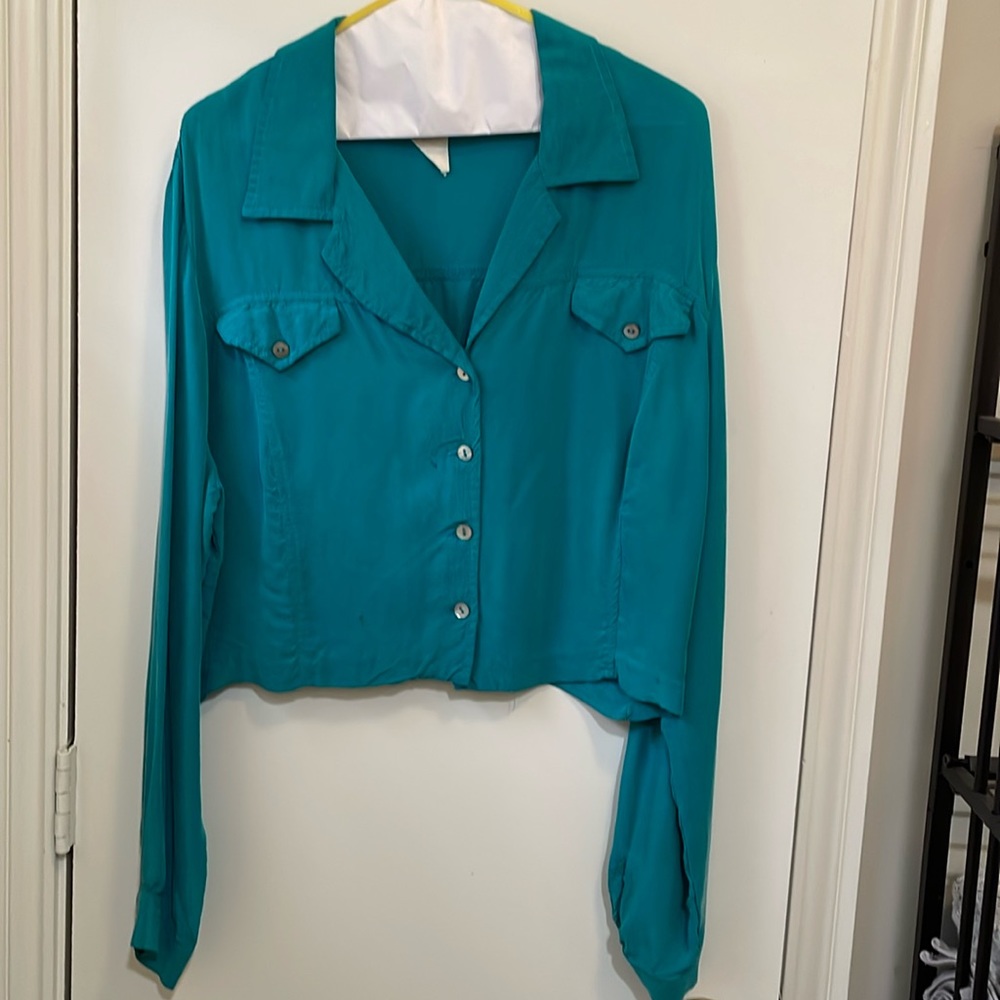 Very soft turquoise short button down shirt. Feels like silk. 2 pockets